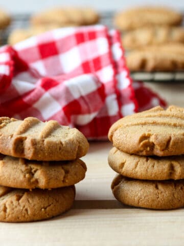 Two stacks of 3 gluten-free peanut butter cookies.